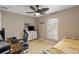 Well-lit bedroom featuring a workspace and comfortable bed at 4122 Library St, Port Charlotte, FL 33948