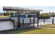 Covered boat lift and dock on the canal at 4122 Library St, Port Charlotte, FL 33948