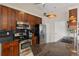 Kitchen features stainless steel appliances and dark wood cabinets at 4122 Library St, Port Charlotte, FL 33948