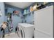 Convenient laundry room with washer, dryer, and storage at 4122 Library St, Port Charlotte, FL 33948