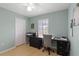 Bright home office with a desk, printer, and storage at 4122 Library St, Port Charlotte, FL 33948