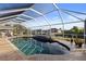 Screened pool and patio overlooking a canal at 4122 Library St, Port Charlotte, FL 33948