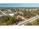 An aerial view of a house nestled in a residential area at 437 Loveland Blvd, Port Charlotte, FL 33954