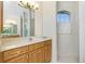 Bathroom with vanity, shower, and window at 437 Loveland Blvd, Port Charlotte, FL 33954