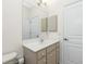 Bathroom with vanity and large mirror at 437 Loveland Blvd, Port Charlotte, FL 33954