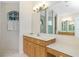 Bathroom with vanity, shower, and linen closet at 437 Loveland Blvd, Port Charlotte, FL 33954