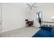 Bedroom with a workspace and blue couch at 437 Loveland Blvd, Port Charlotte, FL 33954