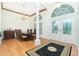 Formal dining room with hardwood floors and a chandelier at 437 Loveland Blvd, Port Charlotte, FL 33954