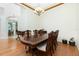 Bright dining room with hardwood floors and a large table at 437 Loveland Blvd, Port Charlotte, FL 33954