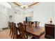 Formal dining room with hardwood floors and elegant chandelier at 437 Loveland Blvd, Port Charlotte, FL 33954