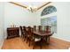 Spacious dining area featuring a large wooden table and chairs at 437 Loveland Blvd, Port Charlotte, FL 33954