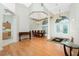 Formal dining room with hardwood floors and a view into the kitchen at 437 Loveland Blvd, Port Charlotte, FL 33954