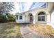 House entrance with double doors and a curved walkway at 437 Loveland Blvd, Port Charlotte, FL 33954