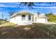 Single-story home with a bay window and landscaped yard at 437 Loveland Blvd, Port Charlotte, FL 33954