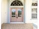 Double front doors with glass panels and tiled flooring at 437 Loveland Blvd, Port Charlotte, FL 33954