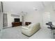 Living room with light beige sofa and wood media console at 437 Loveland Blvd, Port Charlotte, FL 33954