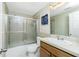 Clean bathroom with a shower/tub combo, vanity, and updated fixtures at 4657 Nele St, North Port, FL 34287