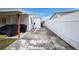 Side yard with paved area and privacy fence at 4657 Nele St, North Port, FL 34287