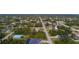 Aerial view showcasing a residential lot and surrounding homes at 5435 Montego Ln, Port Charlotte, FL 33981