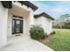 Modern front door with glass panels and sidelights at 5435 Montego Ln, Port Charlotte, FL 33981