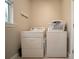 Laundry room featuring washer, dryer, and a laundry basket at 5435 Montego Ln, Port Charlotte, FL 33981