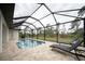 Large screened-in pool with plenty of lounging space at 5435 Montego Ln, Port Charlotte, FL 33981