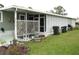 Well-maintained home with covered porch and large yard at 5448 Joy Ct, North Port, FL 34287