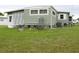 Exterior view of a green single story home at 5448 Joy Ct, North Port, FL 34287