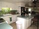 Open kitchen with island and bamboo backsplash at 5448 Joy Ct, North Port, FL 34287