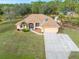 Aerial view of a single-story house with solar panels and a large yard at 5465 Trumpet St, North Port, FL 34291