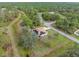 Aerial view of a single Gathering home with solar panels, situated on a spacious lot at 5465 Trumpet St, North Port, FL 34291