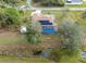 Aerial view of house with pool and solar panels; shed visible at 5465 Trumpet St, North Port, FL 34291