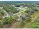 Aerial view of a residential neighborhood, highlighting a home with a pool at 5465 Trumpet St, North Port, FL 34291