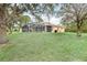 Private backyard with pool and lush lawn at 5465 Trumpet St, North Port, FL 34291