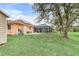 Spacious backyard with large oak trees at 5465 Trumpet St, North Port, FL 34291