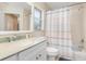 Clean bathroom with updated vanity and colorful shower curtain at 5465 Trumpet St, North Port, FL 34291