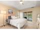 Main bedroom with private access to the pool area at 5465 Trumpet St, North Port, FL 34291