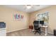 Home office with desk, two monitors, and great natural light at 5465 Trumpet St, North Port, FL 34291