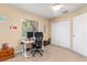 Home office with desk, two monitors, and ample closet space at 5465 Trumpet St, North Port, FL 34291