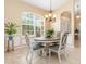 Bright dining room with a charming table and chairs at 5465 Trumpet St, North Port, FL 34291