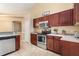 Kitchen with stainless steel appliances and wood cabinets at 5465 Trumpet St, North Port, FL 34291