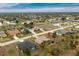 Aerial view showing a single-Gathering home in a residential neighborhood at 594 Rotonda Cir, Rotonda West, FL 33947