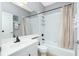 Bathroom with a bathtub, shower, and white vanity at 594 Rotonda Cir, Rotonda West, FL 33947