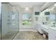 Double vanity bathroom with large shower and window at 594 Rotonda Cir, Rotonda West, FL 33947