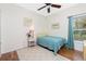 Light and airy bedroom with a twin-size bed and hardwood floors at 594 Rotonda Cir, Rotonda West, FL 33947