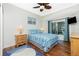 Cozy bedroom with wood floors, a full bed, and sliding glass doors at 594 Rotonda Cir, Rotonda West, FL 33947