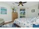 Comfortable bedroom with king bed, hardwood floors, and tranquil view at 594 Rotonda Cir, Rotonda West, FL 33947