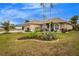 Beautiful two-car garage home with curb appeal at 594 Rotonda Cir, Rotonda West, FL 33947