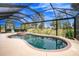 Inviting kidney shaped pool with spa and screened enclosure at 594 Rotonda Cir, Rotonda West, FL 33947