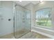 Large walk-in shower with glass enclosure at 594 Rotonda Cir, Rotonda West, FL 33947